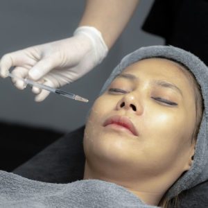 A woman getting botox infection.