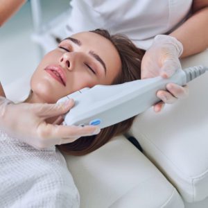 Woman receiving a non surgical face lift.