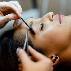 Woman getting her eyebrows worked on at Deja Vu Med Spa and Salon.