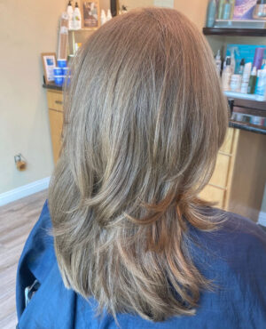 Back of a lady's head showing her finished hair cut.