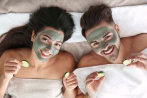 Lady and a man when green facial masks on.