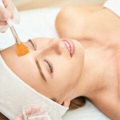 Lady on spa table getting a facial treatment.