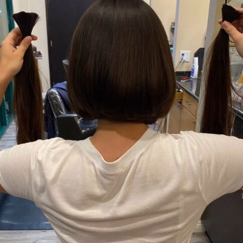 Woman showing off her haircut and style from the back at Deja Vu Med Spa and Salon in Arcadia, CA.