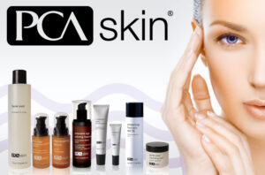 Lady with her hand to the left of her face showing her clear face with PCA Skin products.